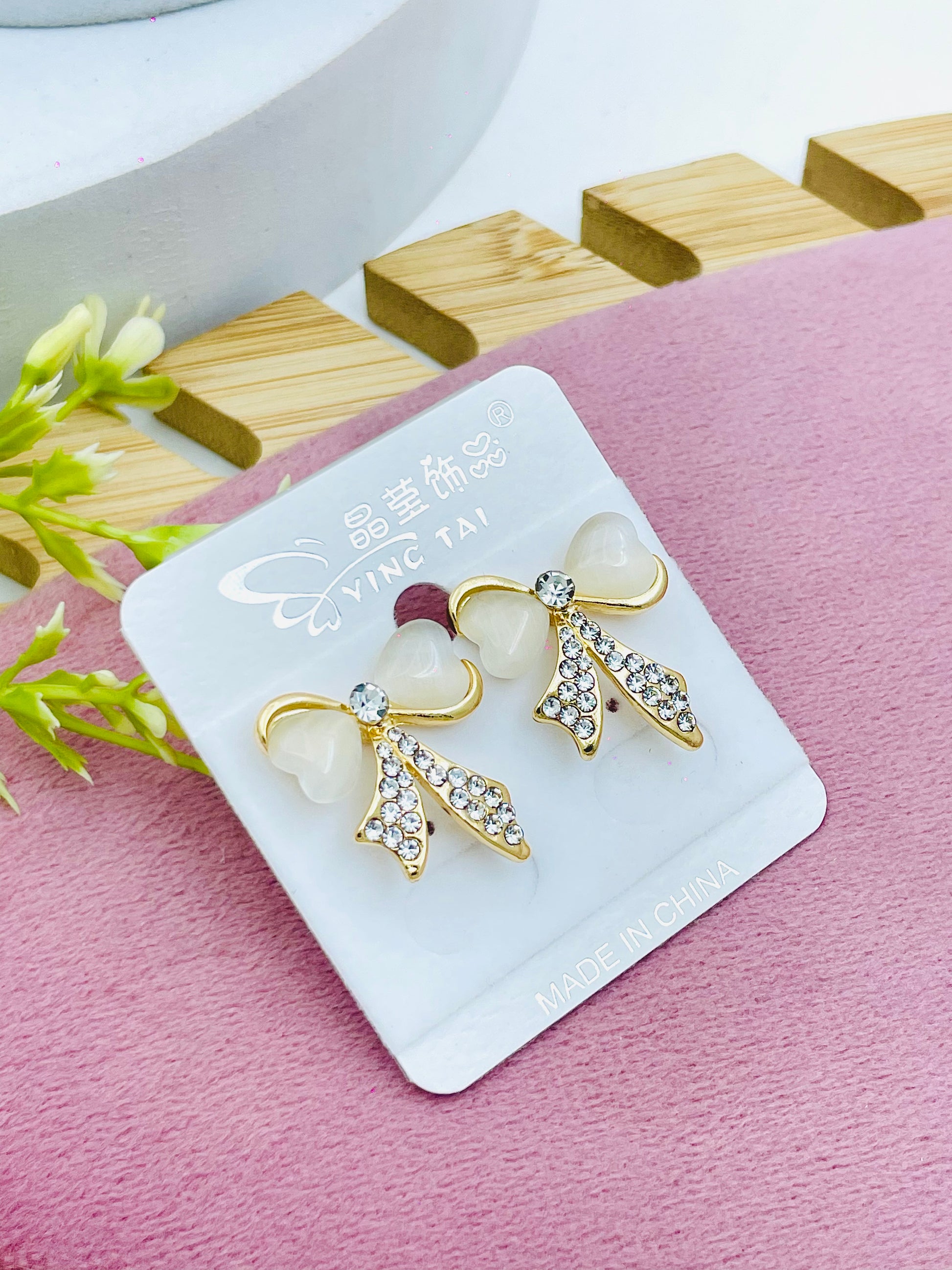 Elegant Crystal Bow Earrings with Heart Detail