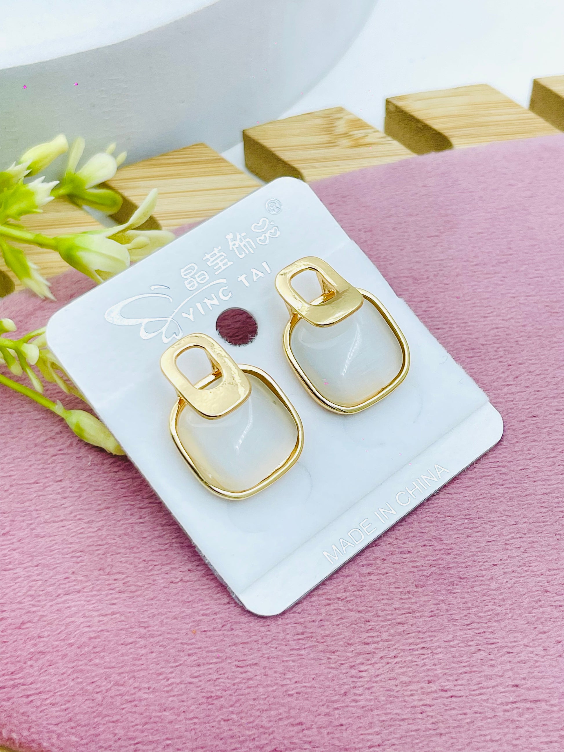 Elegant GoldTrimmed White Stone Earrings