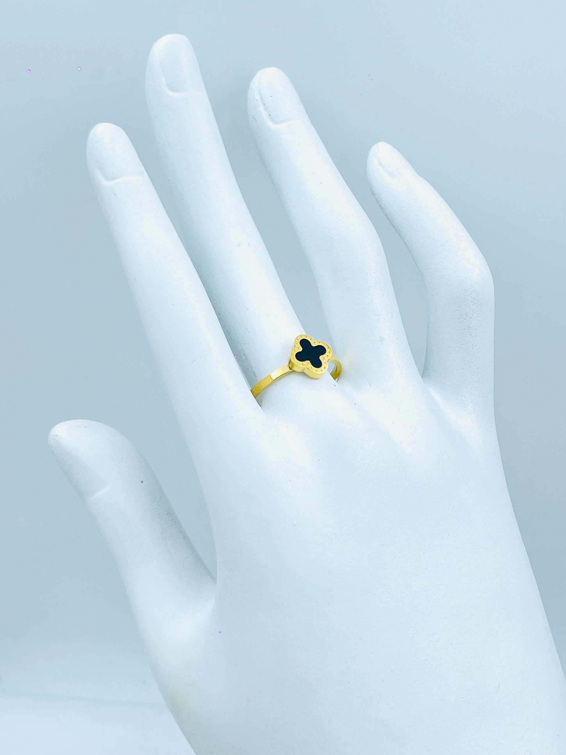 Elegant Gold Ring with Black Clover