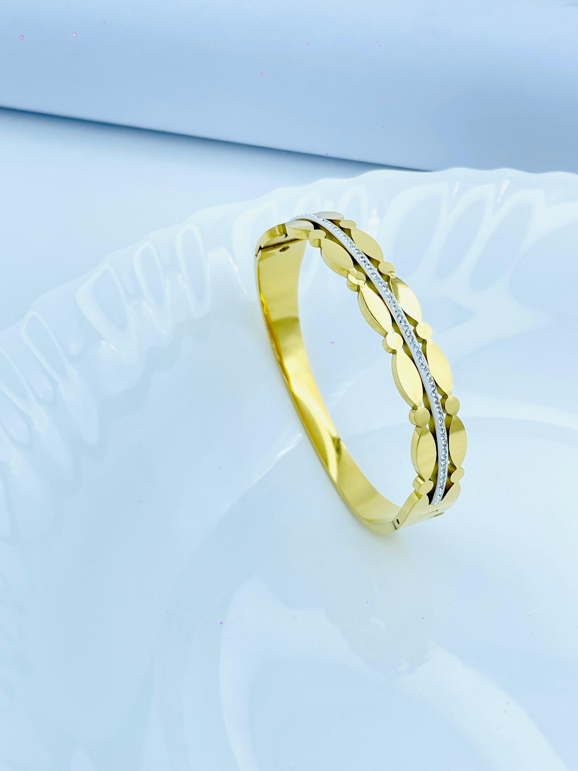 Elegant Gold-Plated Bangle with Scalloped & Crystal Accent Design