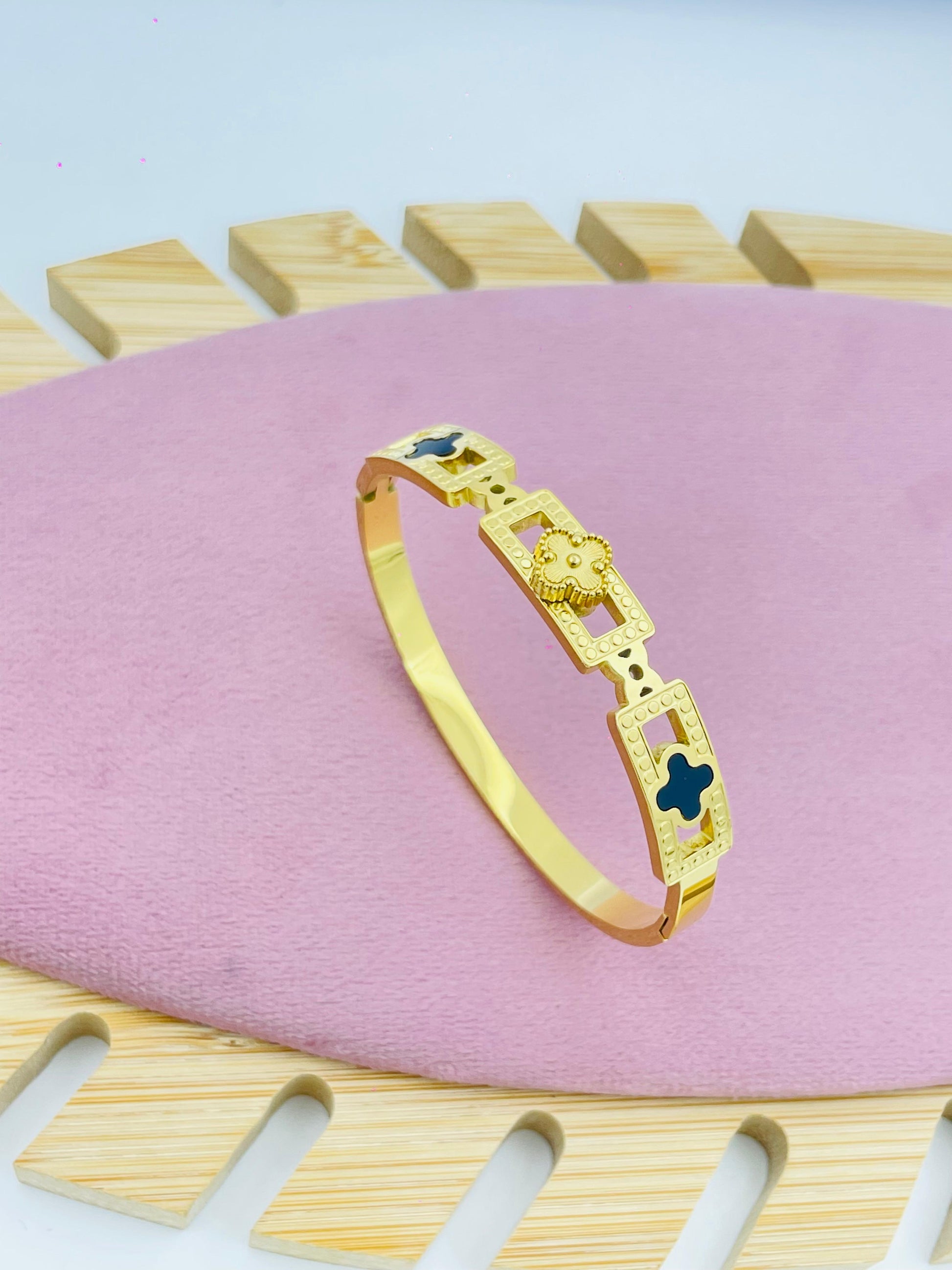 Geometric Bracelet with Floral and Cross Design