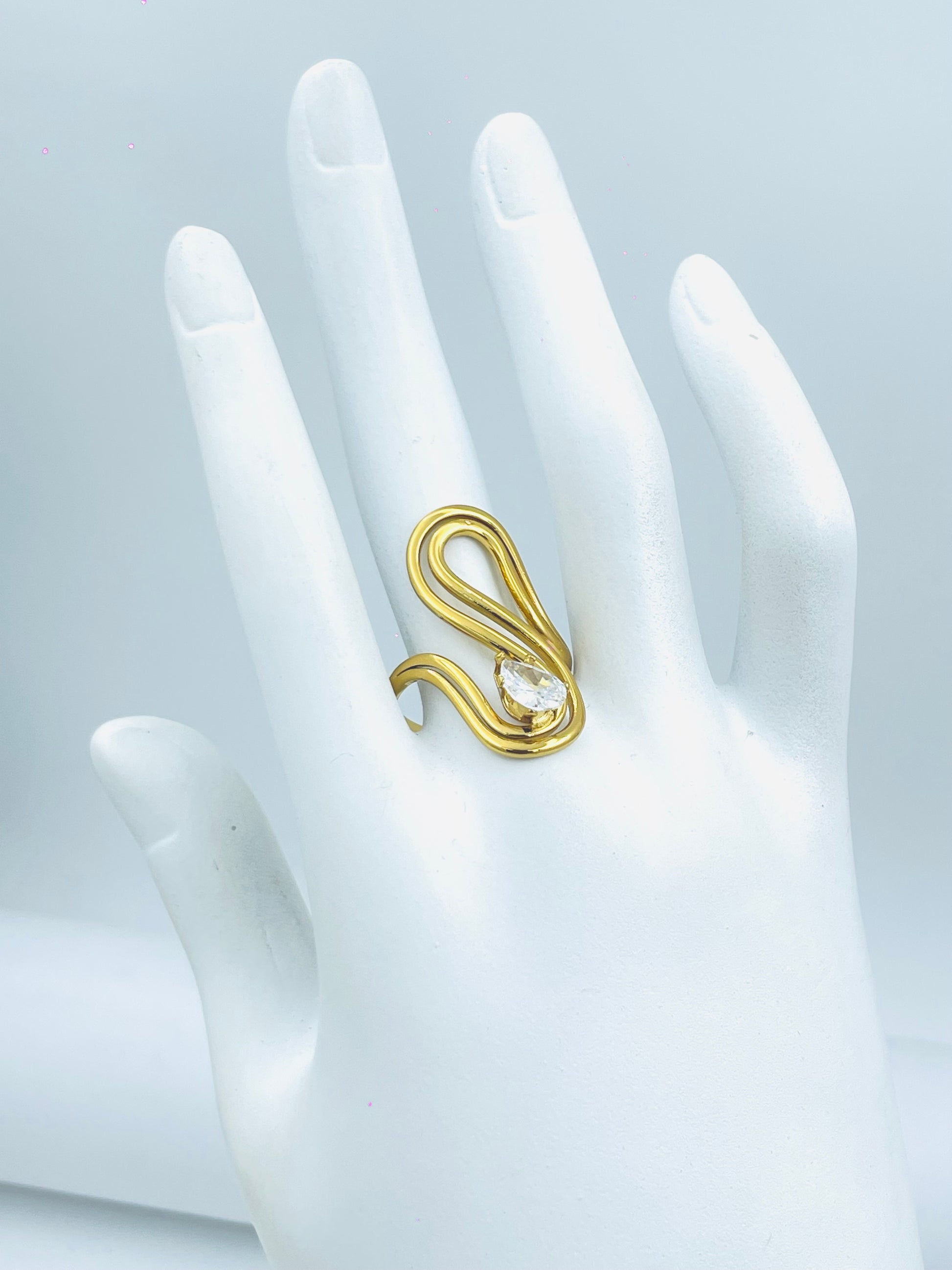 Elegant Gold Wave Ring with Teardrop Gem