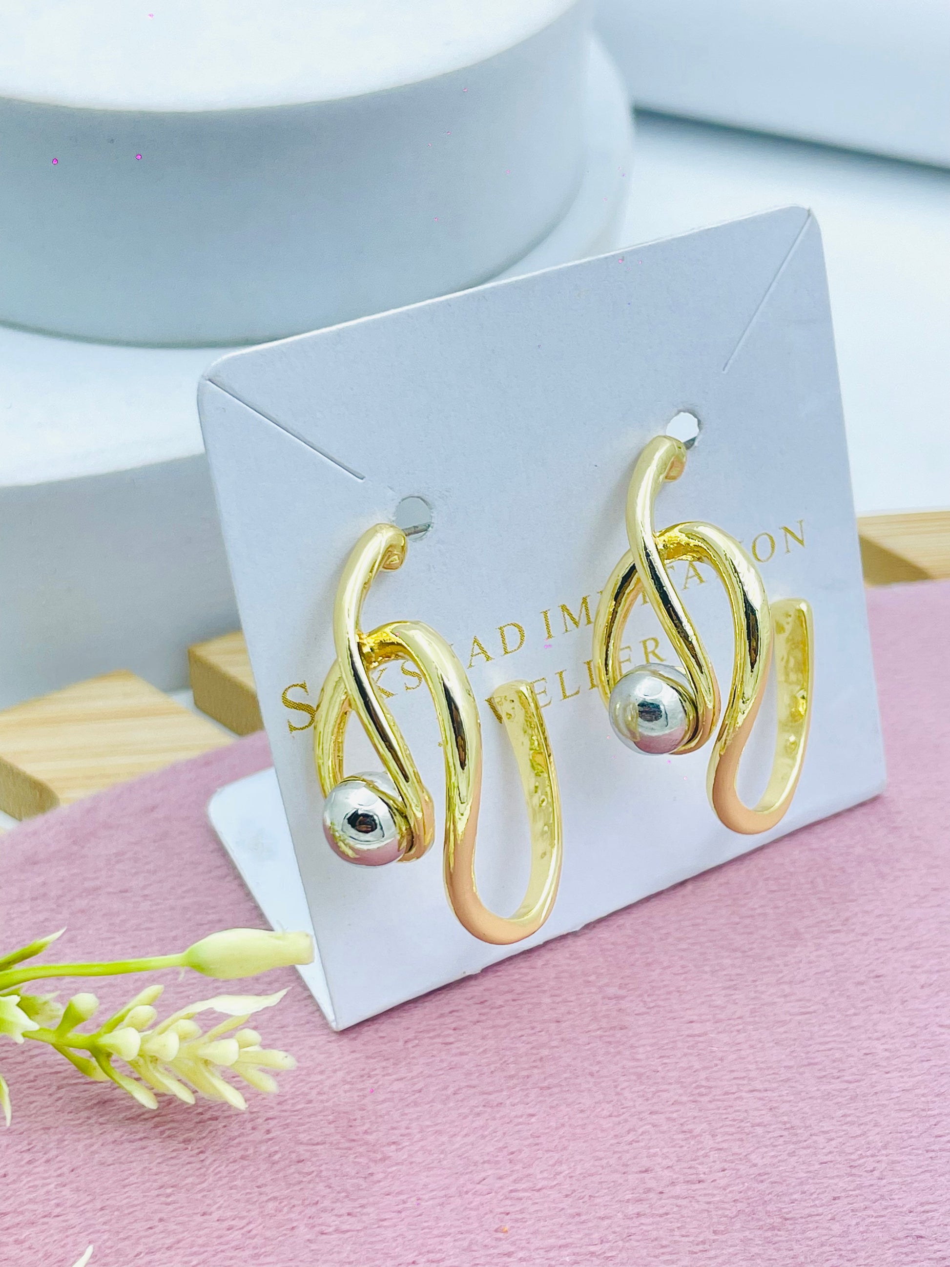 Elegant Gold Swirl Earrings with Silver Accent