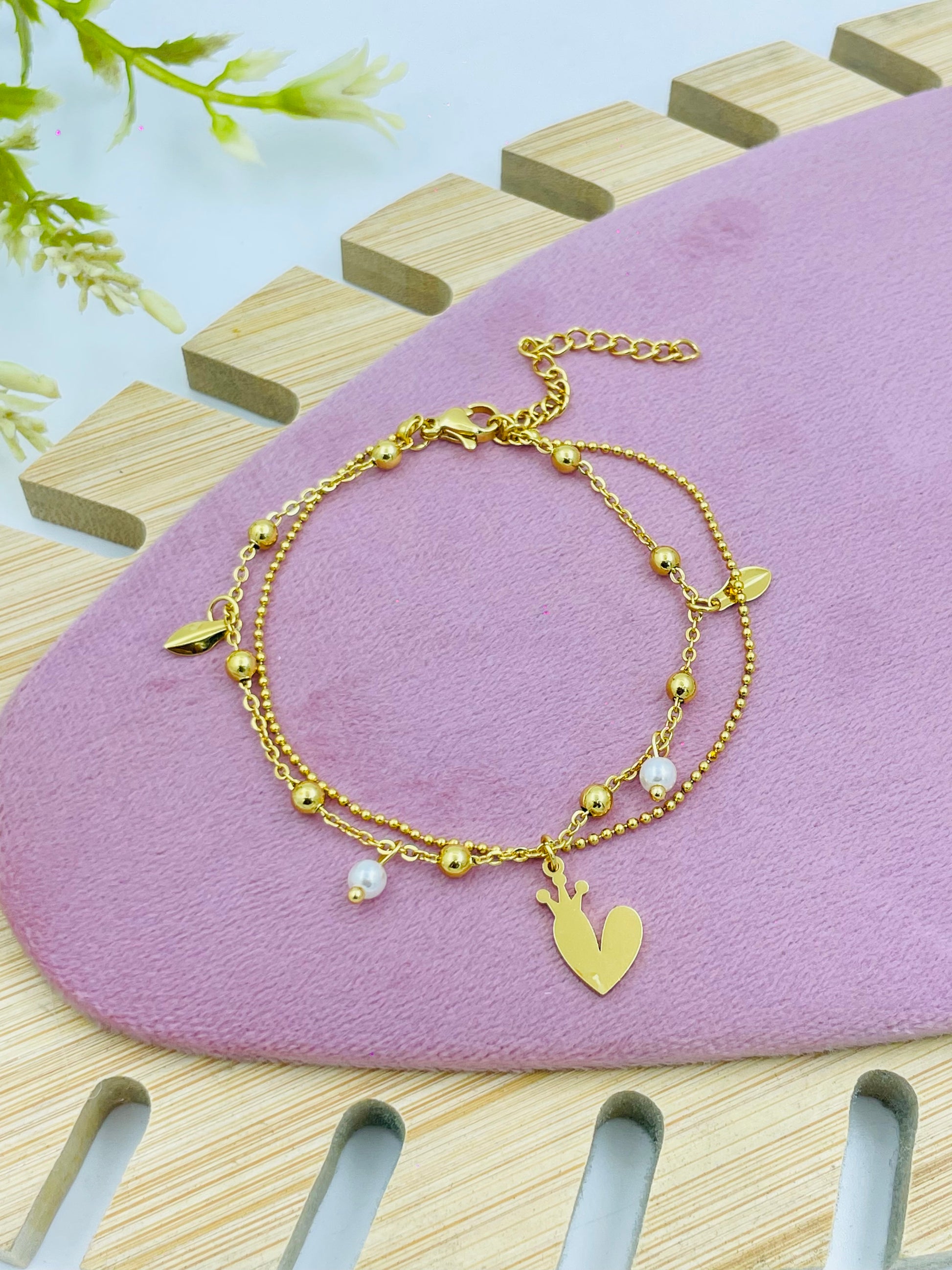 Elegant GoldTone Charm Bracelet with Heart and Leaf Details