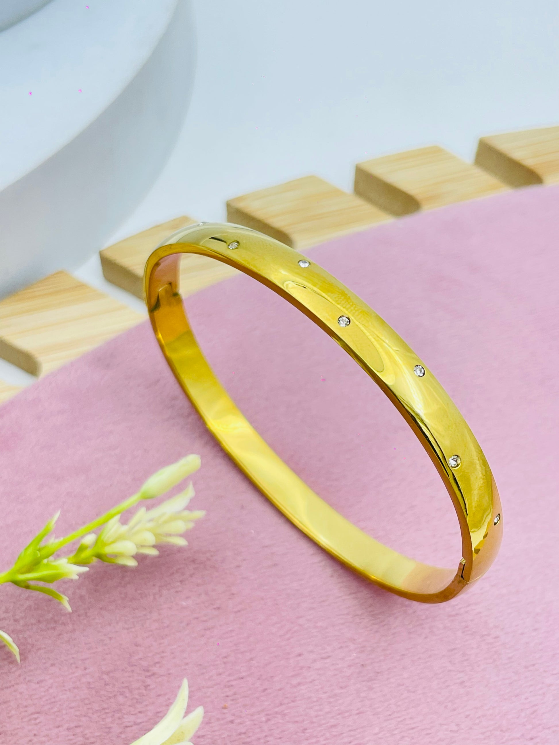 Elegant Gold Bangle with Diamond Accents