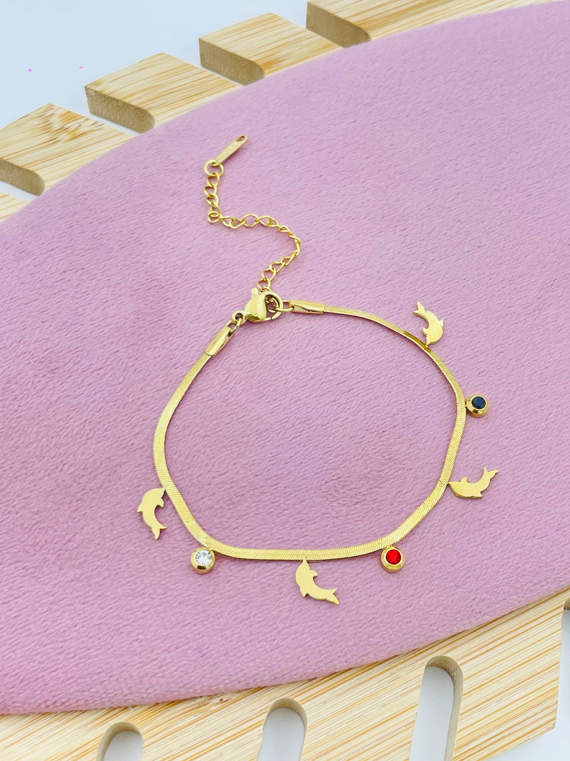 Elegant Gold Dolphin Charm Bracelet with Gemstones